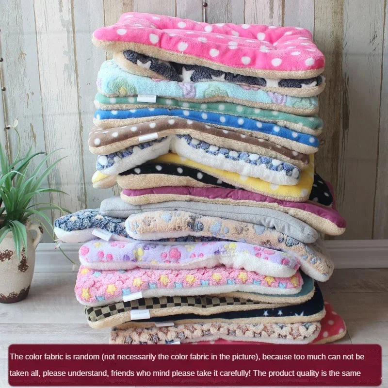 Variety of double-sided pet mats stacked together showing different colors and patterns