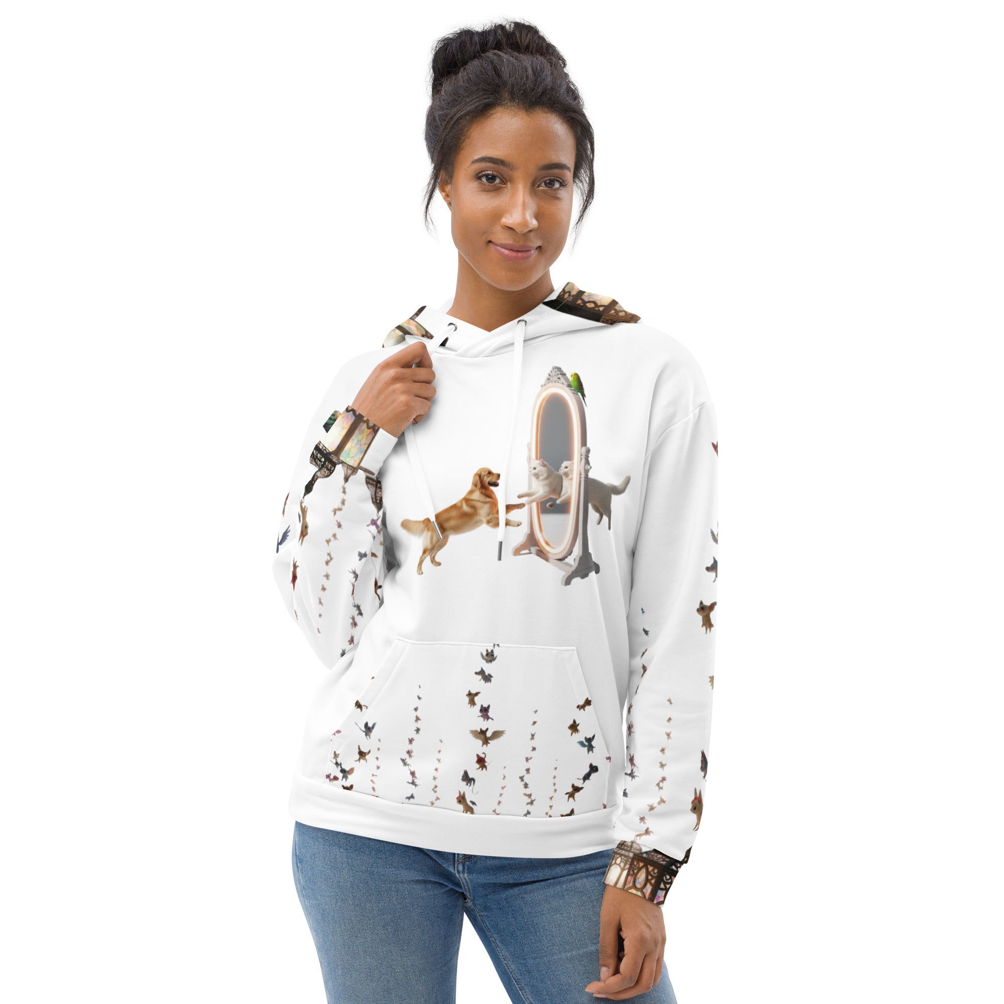 Woman wearing a white hoodie with dog illustrations on a white background