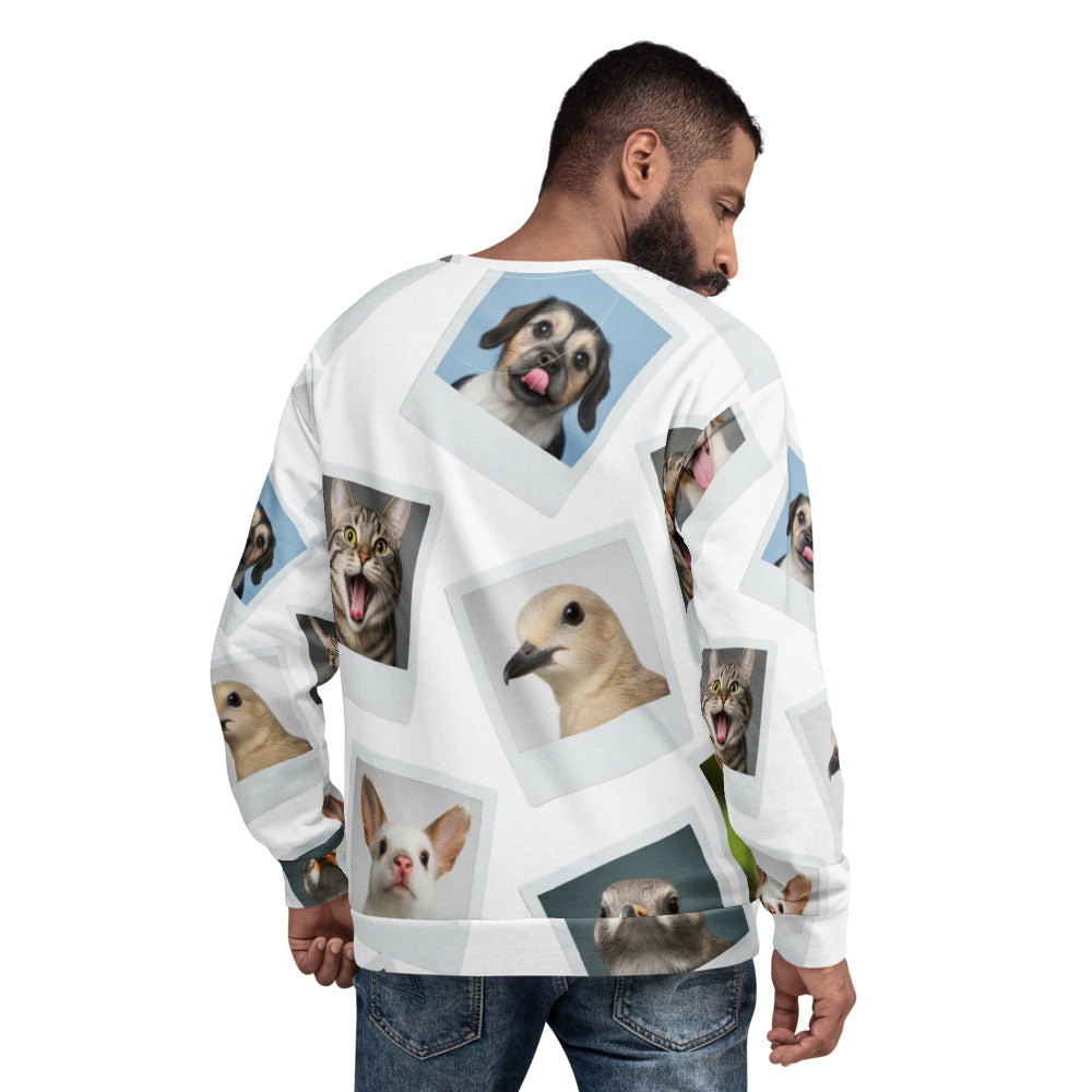 Person wearing a sweater with various animal photos printed on it.